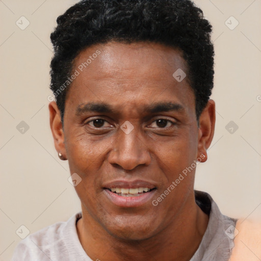 Joyful black adult male with short  black hair and brown eyes