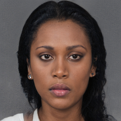 Neutral black young-adult female with long  black hair and brown eyes