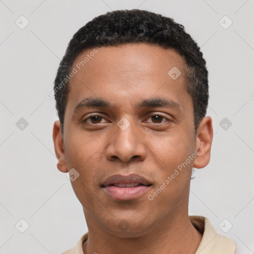 Joyful black young-adult male with short  black hair and brown eyes