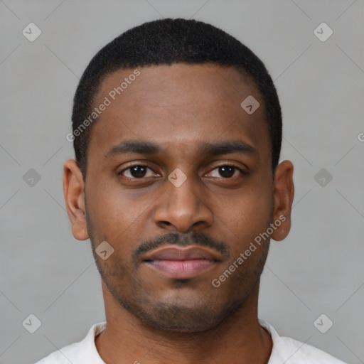 Joyful latino young-adult male with short  brown hair and brown eyes