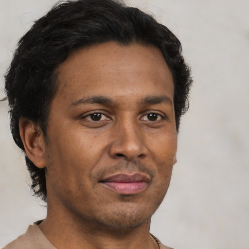 Neutral latino adult male with short  brown hair and brown eyes