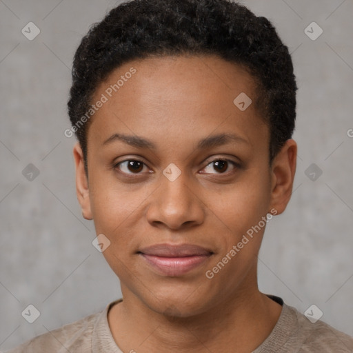 Joyful black young-adult female with short  black hair and brown eyes