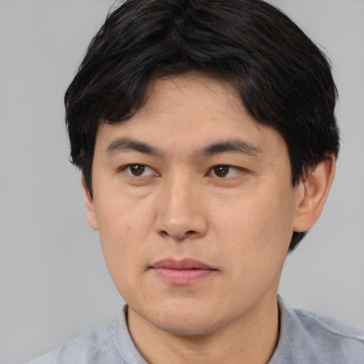 Neutral asian young-adult male with short  black hair and brown eyes