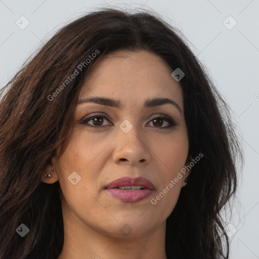 Joyful latino young-adult female with long  brown hair and brown eyes