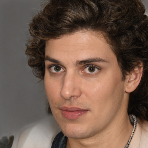 Joyful white young-adult male with medium  brown hair and brown eyes