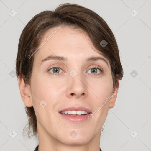 Joyful white young-adult female with short  brown hair and grey eyes