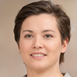 Joyful white young-adult female with medium  brown hair and brown eyes