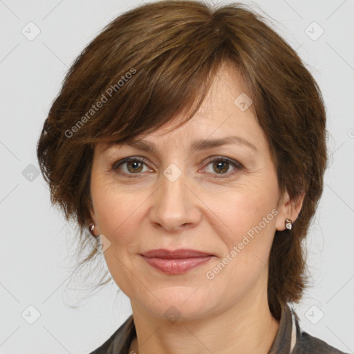 Joyful white adult female with medium  brown hair and brown eyes