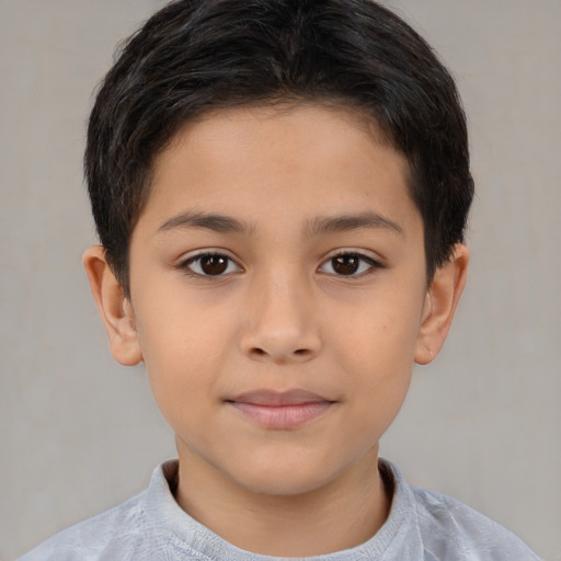 Joyful latino child female with short  brown hair and brown eyes