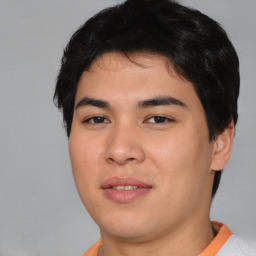 Joyful asian young-adult male with short  black hair and brown eyes