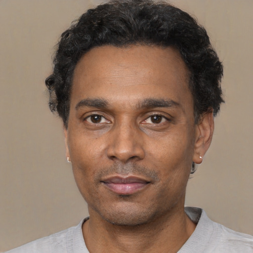 Neutral latino adult male with short  black hair and brown eyes