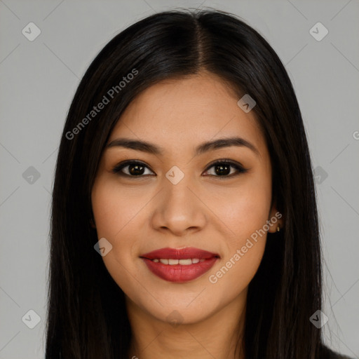 Joyful latino young-adult female with long  brown hair and brown eyes