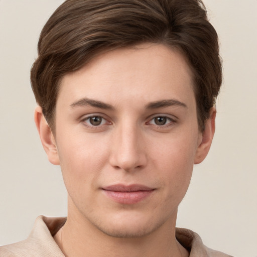 Joyful white young-adult female with short  brown hair and grey eyes