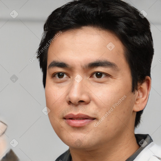 Joyful asian young-adult male with short  black hair and brown eyes