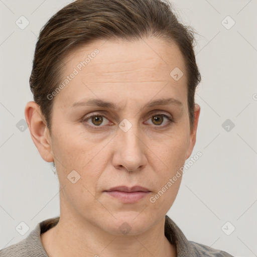 Joyful white adult female with short  brown hair and grey eyes