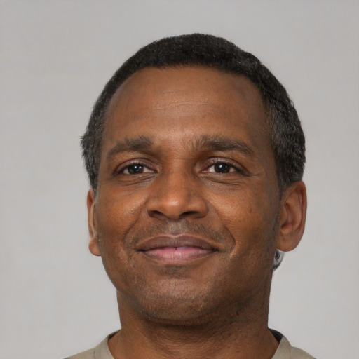 Neutral black adult male with short  black hair and brown eyes