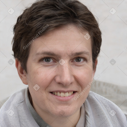 Joyful white adult female with short  brown hair and grey eyes