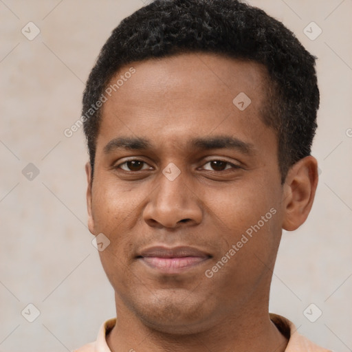 Joyful latino young-adult male with short  brown hair and brown eyes