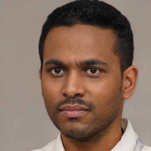 Neutral latino young-adult male with short  black hair and brown eyes