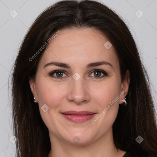 Joyful white adult female with long  brown hair and brown eyes