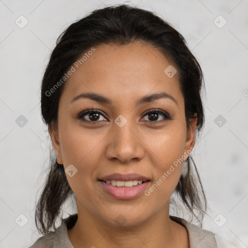 Joyful latino young-adult female with medium  brown hair and brown eyes