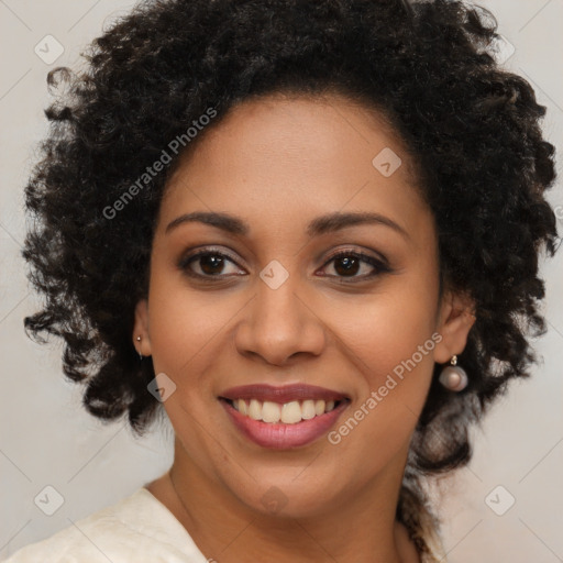 Joyful black young-adult female with medium  brown hair and brown eyes