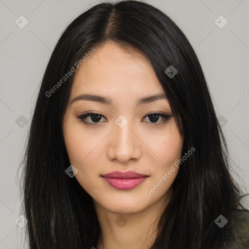 Joyful asian young-adult female with long  black hair and brown eyes