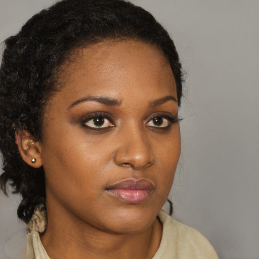 Neutral black young-adult female with medium  brown hair and brown eyes