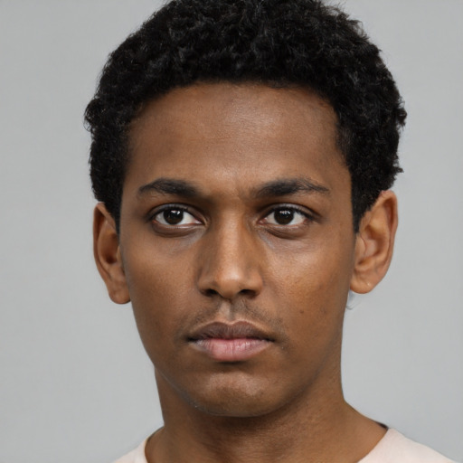 Neutral black young-adult male with short  black hair and brown eyes