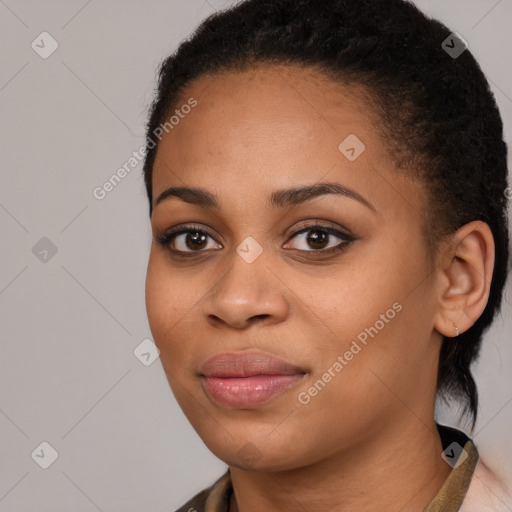 Joyful black young-adult female with long  brown hair and brown eyes