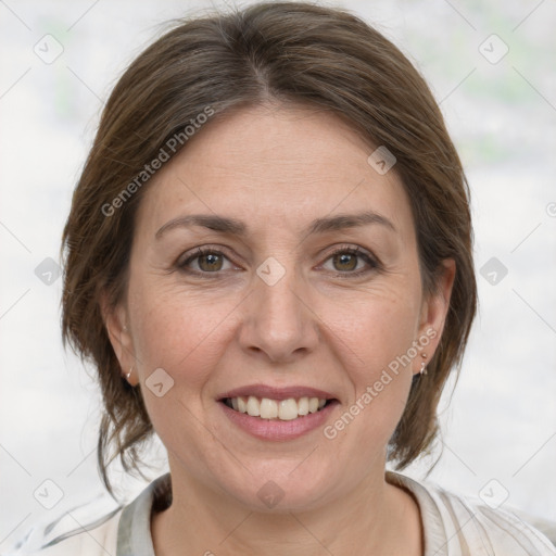 Joyful white adult female with medium  brown hair and grey eyes