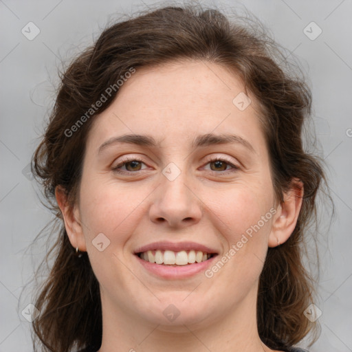 Joyful white young-adult female with medium  brown hair and green eyes