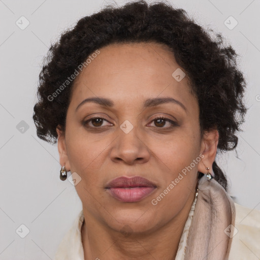 Joyful black adult female with short  brown hair and brown eyes