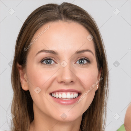 Joyful white young-adult female with long  brown hair and blue eyes