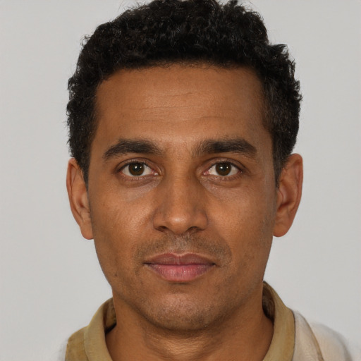 Neutral black young-adult male with short  black hair and brown eyes