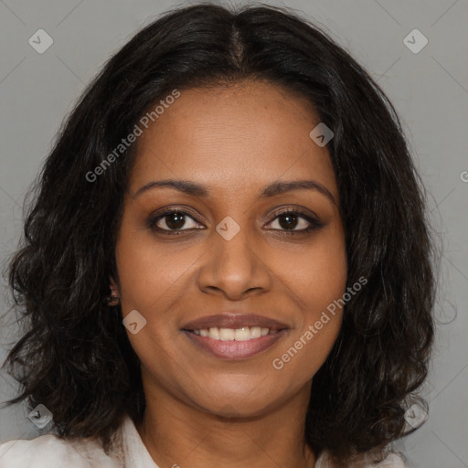 Joyful black young-adult female with long  brown hair and brown eyes