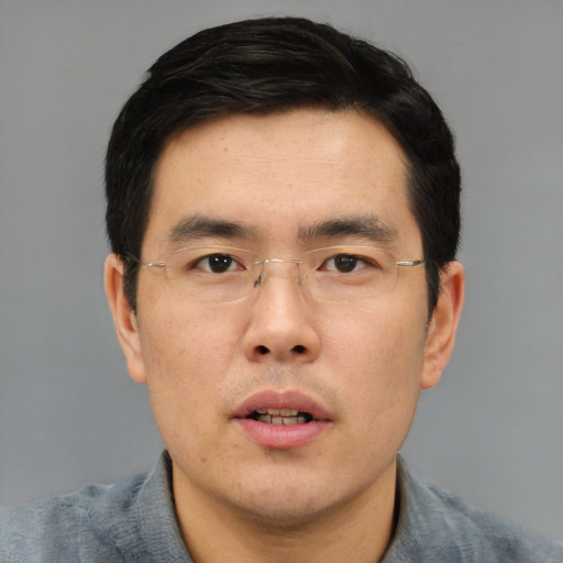 Neutral asian adult male with short  black hair and brown eyes