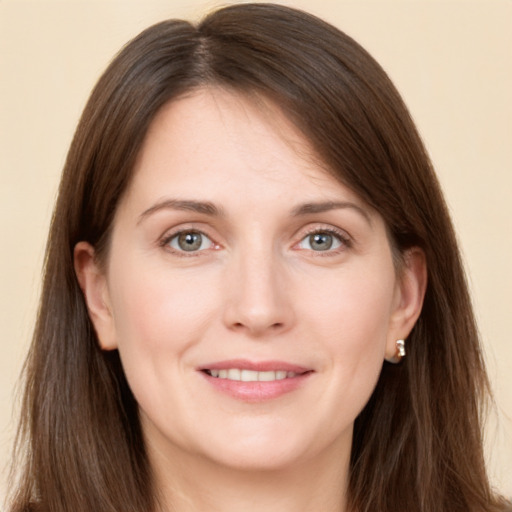 Joyful white young-adult female with long  brown hair and grey eyes