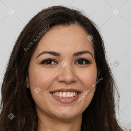 Joyful white young-adult female with long  brown hair and brown eyes