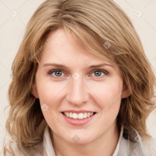 Joyful white young-adult female with medium  brown hair and blue eyes