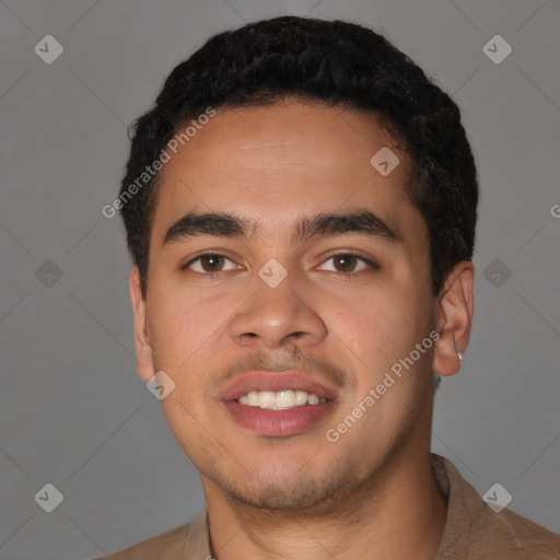 Joyful latino young-adult male with short  black hair and brown eyes