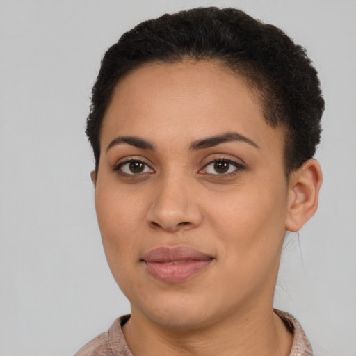 Joyful latino young-adult female with short  brown hair and brown eyes