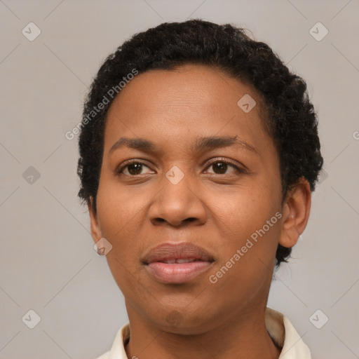 Joyful black adult female with short  black hair and brown eyes