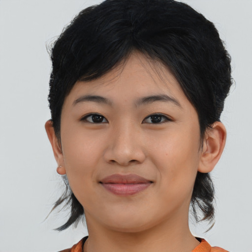 Joyful asian young-adult female with medium  black hair and brown eyes