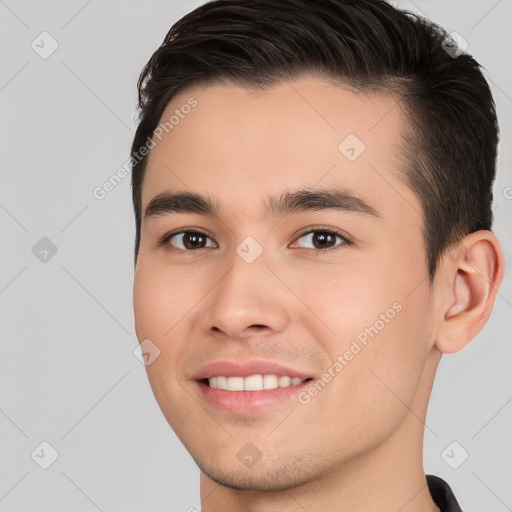 Joyful white young-adult male with short  brown hair and brown eyes