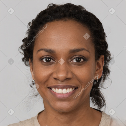 Joyful black young-adult female with medium  black hair and brown eyes