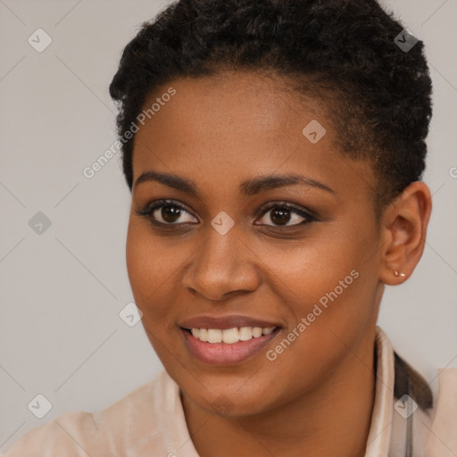 Joyful black young-adult female with short  brown hair and brown eyes