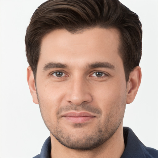 Joyful white young-adult male with short  brown hair and brown eyes