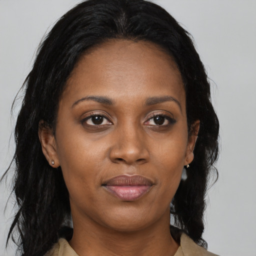 Joyful black young-adult female with medium  black hair and brown eyes