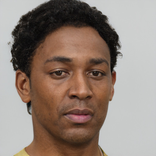 Neutral black young-adult male with short  brown hair and brown eyes